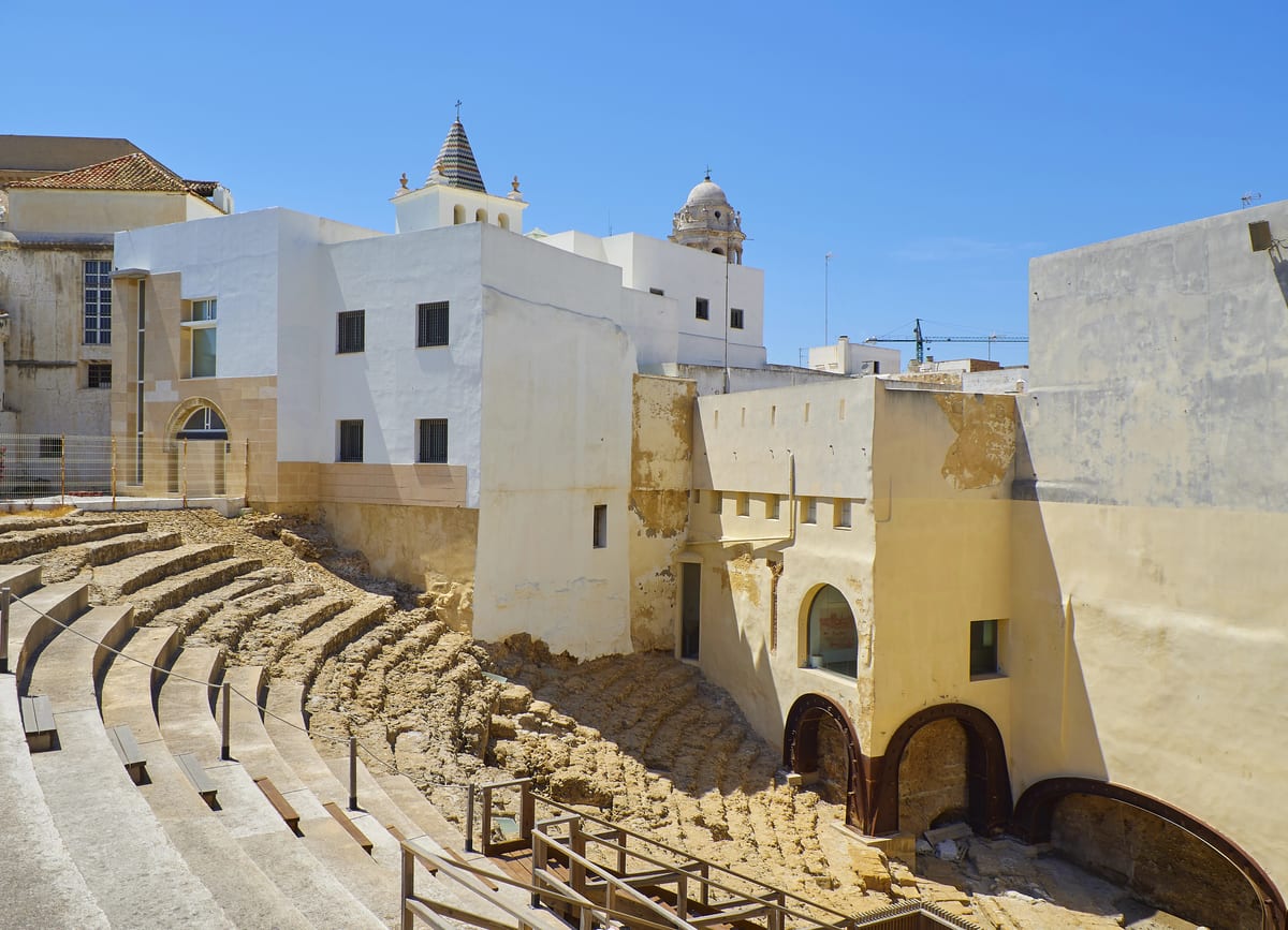 A Roman Amphitheater and white Spanish-type buildings; the Roman Theatre in Spain
